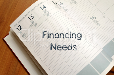 Financing needs write on notebook