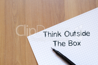 Think outside the box write on notebook