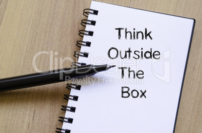 Think outside the box write on notebook