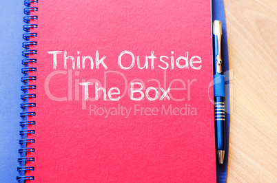 Think outside the box write on notebook