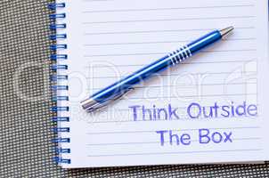 Think outside the box write on notebook