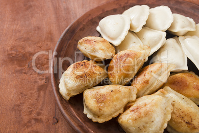 Vareniks fried in butter and cooked in water