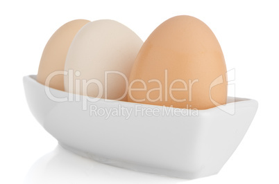 Brown eggs in white ceramic bowl