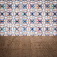 Wood table top and blur vintage ceramic tile pattern wall