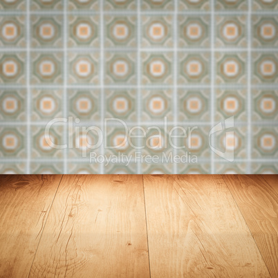 Wood table top and blur vintage ceramic tile pattern wall