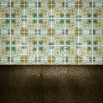 Wood table top and blur vintage ceramic tile pattern wall