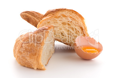 Croissant and raw egg