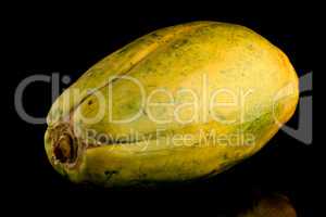 Papaya fruit on black background