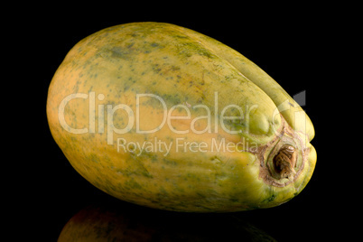 Papaya fruit on black background