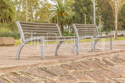 Wooden Chairs at the Boardwalk of Santa Lucia River in Montevide