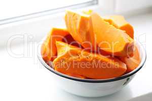 pieces of fresh raw pumpkin in a bowl