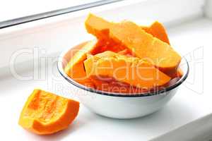 pieces of fresh raw pumpkin in a bowl
