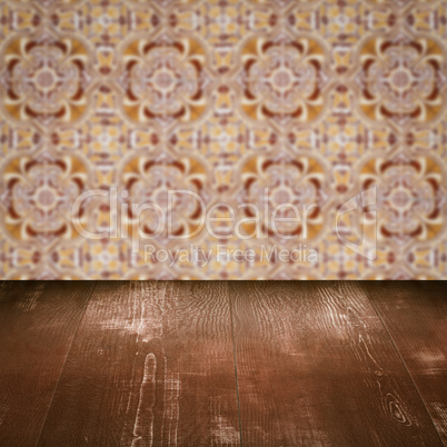 Wood table top and blur vintage ceramic tile pattern wall Wood table top and blur vintage ceramic tile pattern wall