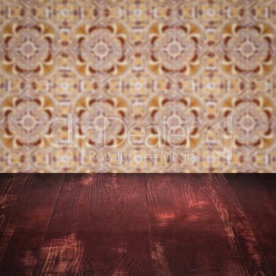Wood table top and blur vintage ceramic tile pattern wall Wood table top and blur vintage ceramic tile pattern wall
