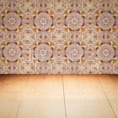 Wood table top and blur vintage ceramic tile pattern wall