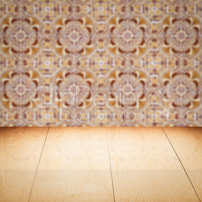 Wood table top and blur vintage ceramic tile pattern wall