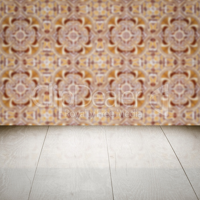 Wood table top and blur vintage ceramic tile pattern wall