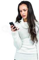 Worried woman using smartphone