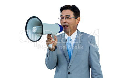 Asian businessman talking through megaphone