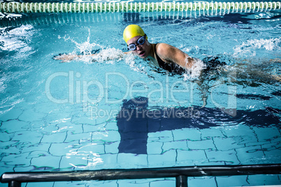 Swimmer woman swimming in the swimming pool