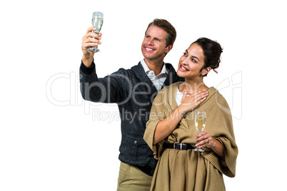 Cheerful couple with champagne flute