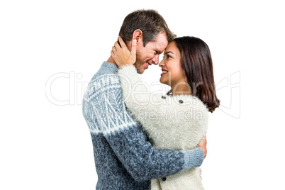 Couple wearing warm clothing embracing