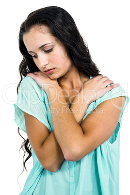 A Sad woman holding herself