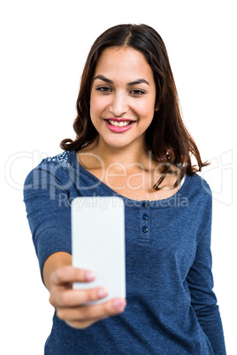 Pretty young woman taking selfie