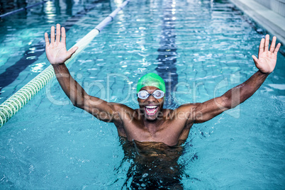 Fit man raising his arms