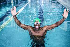 Fit man raising his arms