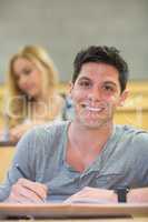 Smiling male student during class