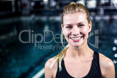 Portrait of a woman swimmer looking the camera