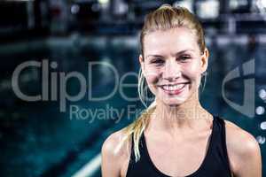 Portrait of a woman swimmer looking the camera