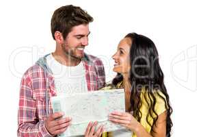 Smiling couple holding map