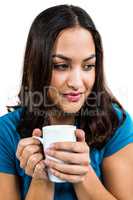 Thoughtful woman holding coffee cup