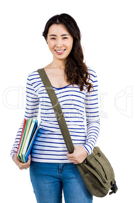 Cheerful woman with shoulder bag and files