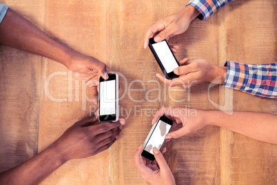 Overhead view of business people using smart phones