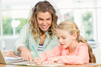 Mother checking daughters homework