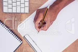 Businessman writing on notebook