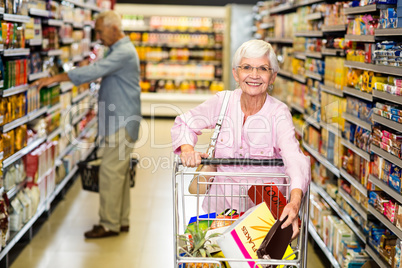 Senior woman picking out product