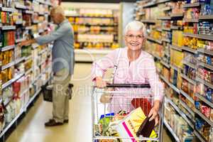 Senior woman picking out product