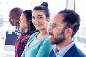 Portrait of businesswoman with colleagues