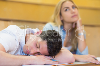 Male students falling asleep during clas