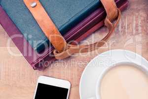 Coffee with smartphone and diaries