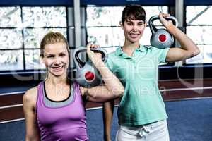 Portrait of women holding kettlebell