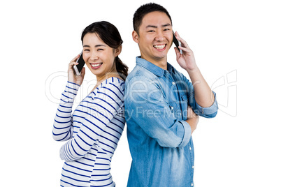 Portrait of happy couple talking on phone