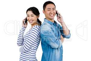 Portrait of happy couple talking on phone