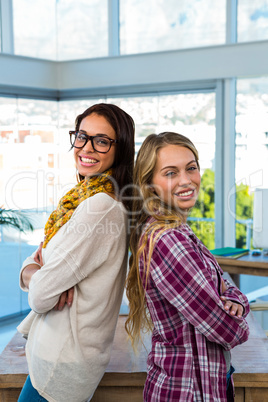 Two girls work at office