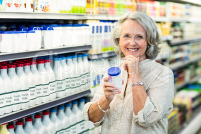 Senior woman buying milk