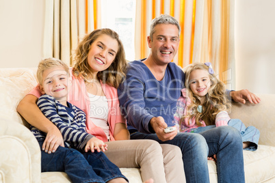 Happy family enjoying a movie together